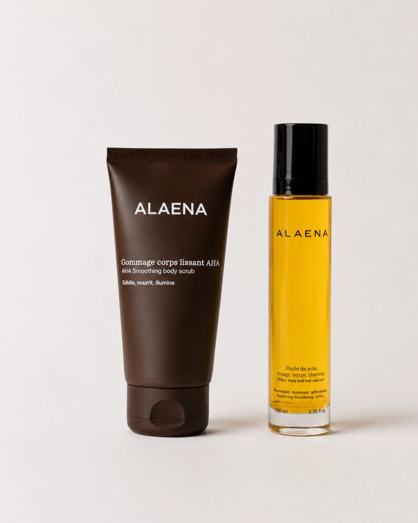 Duo Exfoliation & Éclat Alaena composé d'un gommage corps aux AHA de fruits et d'une huile nourrissante multi-usages
